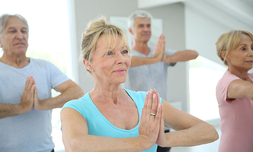 senior people doing yoga